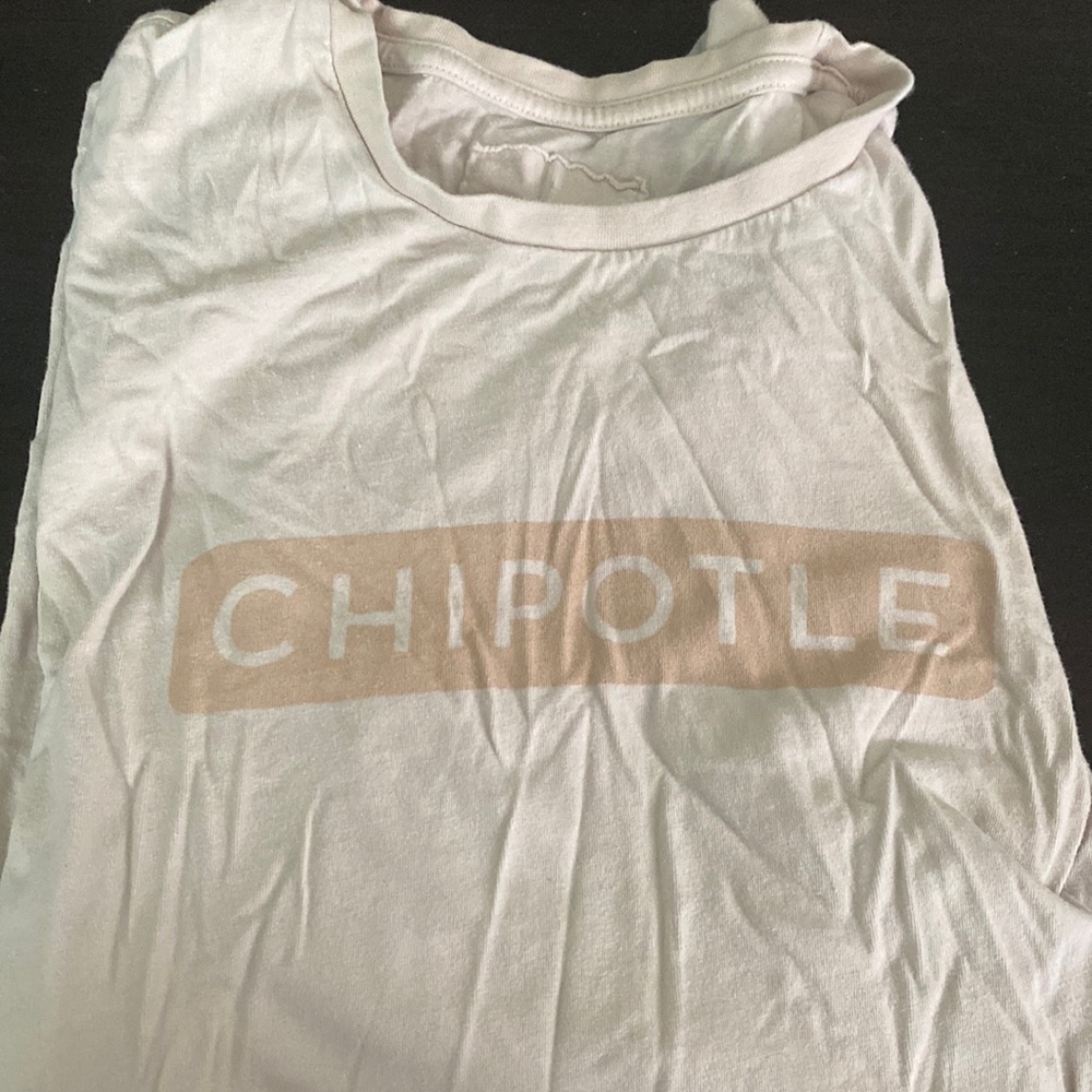 Large, tan Chipotle short sleeve merch.